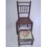 An antique oak country chair plus a footstool