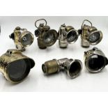 A collection of seven vintage carbide lamps including Powell & Hanmer "The Revenge", "New 75" and "