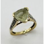 A 9ct gold trillion cut aquamarine ring