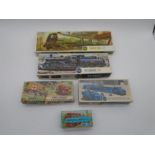 A collection of four boxed Airfix OO gauge model kits including Biggin Hill steam locomotive (Kit