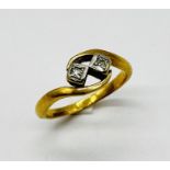 An 18ct gold and platinum diamond two stone ring, weight 4.2g
