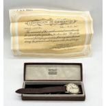 A cased 9ct gold Garrard wristwatch with subsidiary second dial, inscription to reverse
