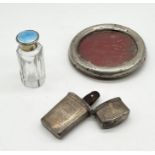 A hallmarked silver case with two blood letting tools (catch broken), silver and enamelled topped