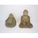 Two stone Buddha garden ornaments.
