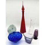 A collection of various art glass including large red decanter, cobalt glass bowl etc.