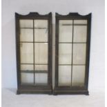 A pair of turn of the century glazed gun cabinets, one with drawer under - approximate measurements: