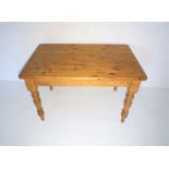 A modern pine farmhouse table, length 122cm, width 75cm, height 77cm.