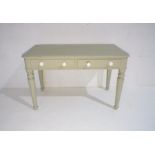 A Victorian painted side table with two drawers, raised on fluted legs, length 106cm.