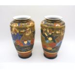 A pair of Japanese ceramic Satsuma vases with marks to base, height 30cm.