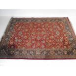 An Afghan red ground rug made in Kandahar - Overall size 345cm x 239cm