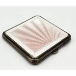 An Art Deco hallmarked silver and pink guilloche enamelled compact