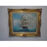 A framed oil painting on canvas of sailing ship at sea, signed Ambrose - overall size 58cm x 68cm