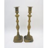 A pair of brass candlesticks.