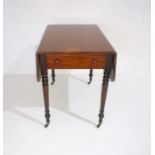A Georgian mahogany Pembroke table with single drawer, raised on turned legs.