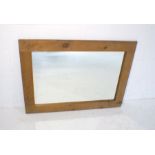 A pine framed rectangular wall mirror, 111cm x 80cm.