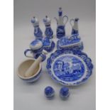 A collection of Spode Blue Italian including olive oil pourers, over sided salt and pepper, butter