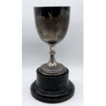 A large hallmarked silver trophy on stand, trophy weight 216.5g