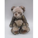 A Charlie Bears "Pandy" plush jointed teddy bear with original tags and bell (CB0104643)