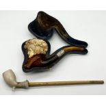 A cased Meerschaum pipe of an Edwardian lady with SCM collar and amber mouthpiece along with a