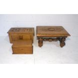 A carved wooden stool along with two wooden boxes.