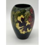 A Moorcroft "Hibiscus" ovoid vase, signed to base with original sticker - height 18cm