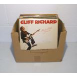 A quantity of 12" vinyl records including a signed Cliff Richard album, Michael Jackson, The