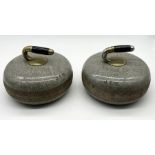 A pair of Scottish granite curling stones with ebonised wood and brass handles, marked 1 & 2 with