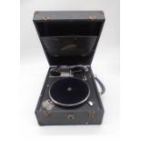 A vintage Crescendo portable (made by Decca) gramophone with a selection of records including