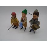 Three vintage Schuco clockwork tinplate toys including a gentleman drinking from a stein wearing