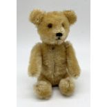 A plush teddy bear scent bottle with removable head, articulated limbs, short golden mohair,