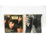 Two 12" vinyl records by The Rolling Stones comprising of 'Out Of Our Heads' and 'Sticky Fingers'