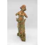 A well weathered terracotta statue of a lady (A/F) - height 56cm