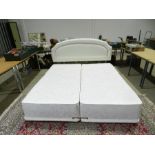 A Shakespeare kingsize double bed consisting of two single 5ft mattresses zipped together -