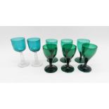 A quantity of Victorian green drinking glasses.