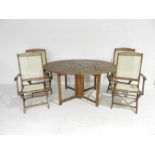 A Royal Craft teak garden table and four matching chairs with canvas seats
