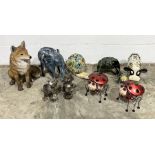 A collection of garden ornaments including metal animals, large fox etc.