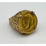 A 1914 half sovereign set into a 9ct gold ring, total weight 11g