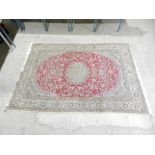 A red ground woollen rug - 287cm x 192cm