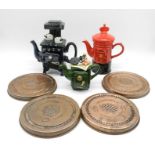 Three novelty teapots along with four copper biscuit moulds