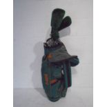 A set of right-handed golf clubs including Mizuno Astron irons (clubs 3 to 9 and sand wedge),