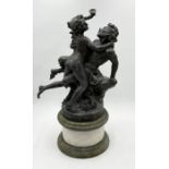A bronze figure group after Claude Michel "Clodion" of a Satyr and Nymph, mounted on a marble
