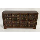 A Chinese chest of sixteen drawers with chinoiserie decoration W152cm x D34cm x H82cm