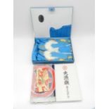 A boxed Chinese silk night outfit along with a boxed flag