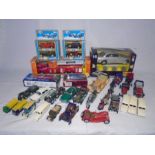 A collection of die-cast and plastic vehicles including Team Power fire truck, Maisto Jaguar S-Type,