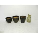 A reconstituted stone figure of a cat along with three glazed garden pots