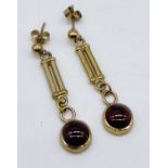 A pair of 9ct gold and garnet earrings