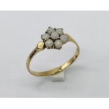 A 9ct gold ring set with a cluster of opals