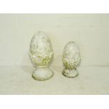 Two painted garden pineapple finials