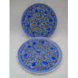Two 19th Century tin glazed pottery platters with Islamic style decoration, stilt marks to