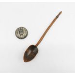 A miniature SCM compact along with a treen spoon.